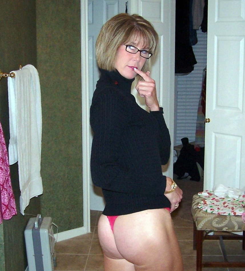 Exciting mature girlfriend is taking off her clothes for fun
